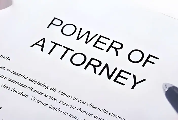 A power of attorney is shown on top of the page.