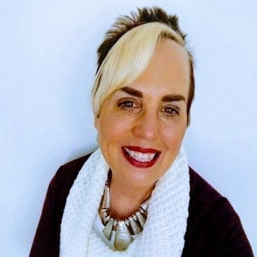 A woman with blonde hair and red lipstick.